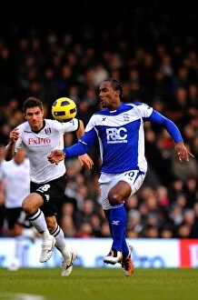 Images Dated 27th November 2010: Hughes vs. Jerome: A Premier League Showdown at Craven Cottage (Fulham vs)
