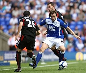 Images Dated 22nd August 2009: Intense Battle: McFadden vs Etherington & Delap - Birmingham City vs Stoke City