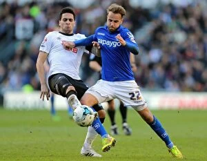 Sky Bet Championship - Derby County v Birmingham City - iPro Stadium Collection: Intense Derby: Shinnie vs Mascarell Battle in Sky Bet Championship Clash at iPro Stadium