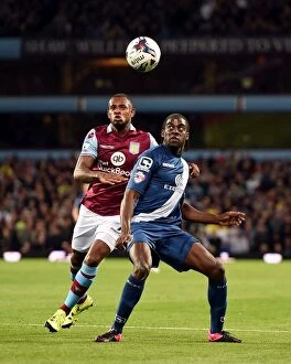 Images Dated 22nd September 2015: Intense Rivalry: Bacuna vs. Donaldson Battle for Ball in Aston Villa vs