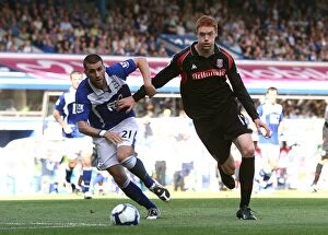 Images Dated 22nd August 2009: Intense Rivalry: Birmingham City vs Stoke City - A Battle for Ball Possession in the Premier