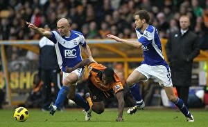 12-12-2010 v Wolverhampton Wanderers, Molineux Collection: Intense Rivalry: Carr, Johnson, and Ebanks-Blake Go Head-to-Head in the Barclays Premier League