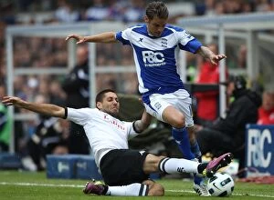 Images Dated 15th May 2011: Intense Rivalry: David Bentley vs. Clint Dempsey - Birmingham City vs. Fulham, Premier League