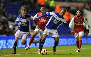 01-01-2011 v Arsenal, St. Andrew's Collection: Intense Rivalry: Larsson, Jerome vs Clichy - A Battle for the Ball (Birmingham City vs Arsenal)
