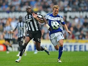 07-05-2011 v Newcastle United, St. James' Park Collection: Intense Rivalry: Larsson vs. Ameobi Battle for Ball in Birmingham City vs