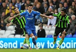 Images Dated 29th October 2011: Intense Rivalry: Liam Ridgewell vs. Brighton & Hove Albion's Defense Line