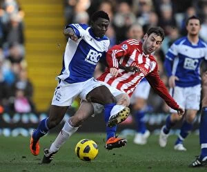Images Dated 12th February 2011: Intense Rivalry: Obafemi Martins vs Rory Delap - Battle for the Ball (Birmingham City vs Stoke City)