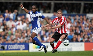 Intense Rivalry: Turner vs Jerome's Battle for Ball Possession - Birmingham City vs Sunderland (Barclays Premier League, St. Andrew's, 16-04-2011)