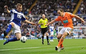 23-10-2010 v Blackpool, St. Andrew's Collection: Larsson Chases Down Vaughan's Cross: Intense Premier League Rivalry between Birmingham City