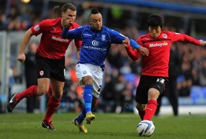 Images Dated 1st January 2013: Nathan Redmond's Slick Moves: Outmaneuvering Kim Bo-Kyung and Ben Turner of Cardiff City