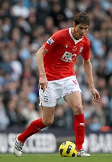 13-11-2010 v Manchester City, City of Manchester Stadium Collection: Nikola Zigic: Birmingham City Star at the Heart of Manchester City Clash in Barclays Premier