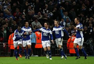 Goal Celebrations Collection: Obafemi Martins Thrilling Game-Winning Goal: Birmingham City's Historic Carling Cup Upset against