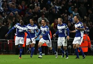 Goal Celebrations Collection: Obafemi Martins Thrilling Goal: Birmingham City's Historic Carling Cup Upset Against Arsenal at