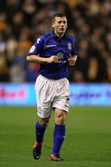 Images Dated 8th December 2012: Paul Caddis Faces Off Against Wolverhampton Wanderers in Championship Clash at Molineux