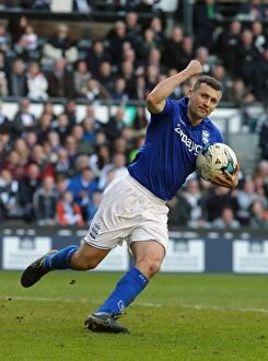 Images Dated 7th March 2015: Paul Caddis Scores Penalty: Birmingham City's Thrilling Victory at iPro Stadium