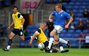 Images Dated 26th July 2011: Pre-Season Showdown: Worley vs. Rooney at The Kassam Stadium (2011) - Oxford United vs