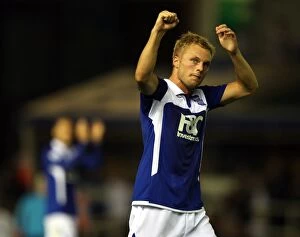 Images Dated 19th August 2009: Sebastian Larsson's Thrilling Goal Celebration: Birmingham City's Victory Against Portsmouth in