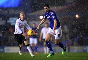 Sky Bet Championship - Birmingham City v Derby County - St. Andrew's Collection: Snowy Showdown: Zigic vs. Hughes - Birmingham City vs. Derby County Championship Battle