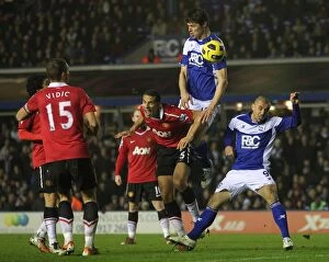 28-12-2010 v Manchester United, St. Andrew's Collection: Zigic's Powerful Showdown: Outmuscling Ferdinand for Bowyer's Equalizer - Manchester United vs